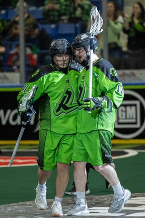 Rush’s Dan Lintner and Robert Church celebrate a goal.