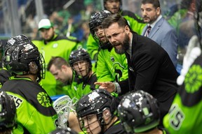 Rush head coach Jimmy Quinlan takes a time out during Saturday’s game.