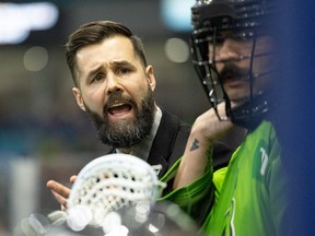 Saskatchewan Rush’s head coach takes a time-out, with Clark Walter at his side, during a NLL game Saturday against San Diego at SaskTel Centre.