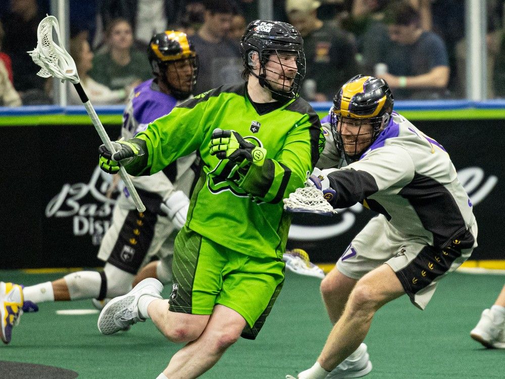 Saskatchewan Rush's Robert Church takes on San Diego during in Saskatoon on March 11, 2023.