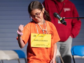 Isabelle Zdunich celebrates correctly spelling a word and placing second in the Saskatchewan First Nations Chapters Spelling Bee in Saskatoon on March 17, 2023.
