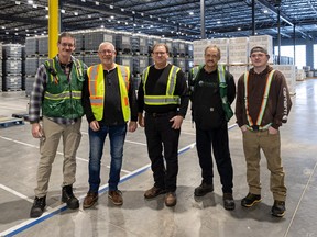 The FBN Warehouse team (from left) Cory Cone, Harold Perrott, Brad Fenty, Peter Szomszed and Ryan Schaefer at the newly built Farmers Business Network Canadian Logistics Hub in Saskatoon on March 9, 2023.