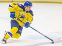 Saskatoon Blades forward Brandon Lisowsky (8) carries the puck up the ice during WHL action against the Prince Albert Raiders in Saskatoon on Dec. 27, 2022.