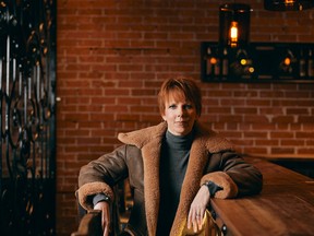 Jackie Kroczynski poses for a photo at the Bon Temps Cafe in Saskatoon. (Nicole Romanoff Photography)