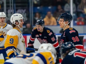 The Regina Pats' Connor Bedard (No. 98) and Saskatoon Blades' Jayden Wiens prepare for a faceoff during a Western Hockey League game this past Sunday. (Heywood Yu)