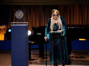 Canadian singer-songwriter Joni Mitchell speaks as she accepts the Library of Congress Gershwin Prize for Popular Song during a ceremony in Washington, DC, March 1, 2023. - US singer/songwriter Joni Mitchell is this year's winner of the Gershwin Prize. (Photo by Stefani Reynolds / AFP)