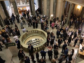 People gather in the Rotunda of the Legislative Building after the reading of the provincial budget on Wednesday, March 22, 2023 in Regina.