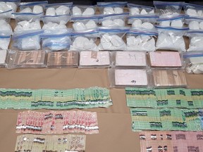 Cocaine, cash and other items seized during a police search just north of Prince Albert on March 16, 2023. The more than 30 kilograms seized is the largest seizure in Prince Albert police history. Photo provided by Prince Albert police.
