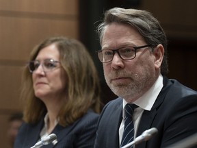 Elections Canada Chief Electoral Officer Stephane Perrault and Commissioner of Canada Elections Caroline Simard wait to appear at the Procedure and House Affairs committee on Parliament hill, in Ottawa, Thursday, March 2, 2023.