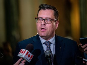 Saskatchewan Minister of Health Paul Merriman speaks to the media, on Wednesday, March 22, 2023. The Saskatchewan government is to spend up to $6 million to send patients to Calgary for hip and knee surgeries.