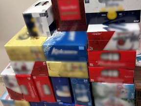 Saskatchewan RCMP have charged a Stony Rapids business with illegal sale of alcohol under provincial liquor laws. Officers seized hundreds of cans of beer, as well as liquor and wine. Photo provided by RCMP