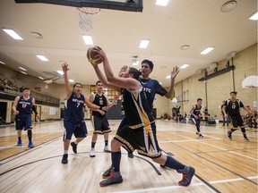 Onion Lake Cree Nation player Graham Pahthyn grabs a rebound against the South East Treaty 4 Tribal Council team during a basketball game in the Tony Cote First Nations Winter Games at Mount Royal Collegiate in Saskatoon, April 4, 2018.