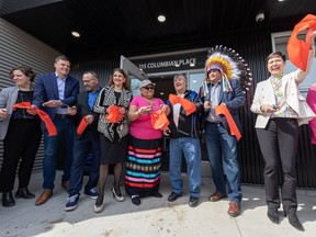 Members of municipal, provincial and federal governments, along with STC chief Mark Arcand and elders, take part in a ribbon cutting during the opening of ikweskicik iskwewak -- the women's traditional support centre for women recently released from Pine Grove Correctional Centre. Photo taken in Saskatoon, Sask. on Friday, April 14, 2023.