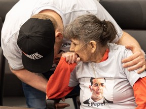 Verna Umpherville, mother of Boden Umpherville, is hugged by Chase Sinclair during a press conference at FSIN headquarters, where family spoke about Boden's injuries sustained during an arrest made by Prince Albert Police which has left him brain dead. Photo taken in Saskatoon, Sask. on Friday, April 21, 2023.