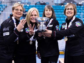 Sherry Anderson (left), Patty Hersikorn, Brenda Goertzen and Anita Silvernagle celebrate their third senior women's world curling title.