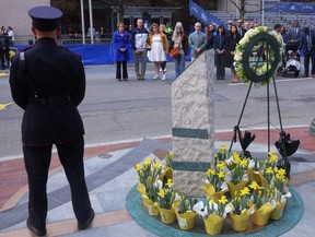 Family members of Boston Marathon bombing victims Martin Richard, Krystle Campbell and Lingzi Lu joins Massachusetts Governor Maura Healey and Boston Mayor Michelle Wu at one of the bomb sites during a ceremony to mark the 10-year anniversary of the bombings in Boston, Saturday, April 15, 2023.