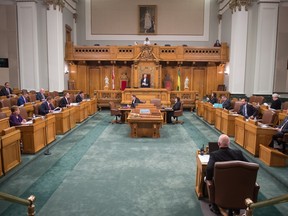 Members of the government and the official opposition sit in the Legislative Assembly chamber on budget day at the Saskatchewan Legislative Building in Regina, Saskatchewan in June of 2020.