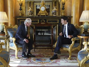 Britain's King Charles III sits with Prime Minister of Canada Justin Trudeau, as he receives prime ministers in the 1844 Room at Buckingham Palace in London, Saturday, Sept. 17, 2022.