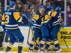 The Saskatoon Blades, shown here celebrating a WHL playoff goal against the Regina Pats at SaskTel Centre, defeated the Red Deer Rebels on Wednesday to stay alive in that WHL Eastern Conference semifnal series. (Heywood Yu Photograph)
