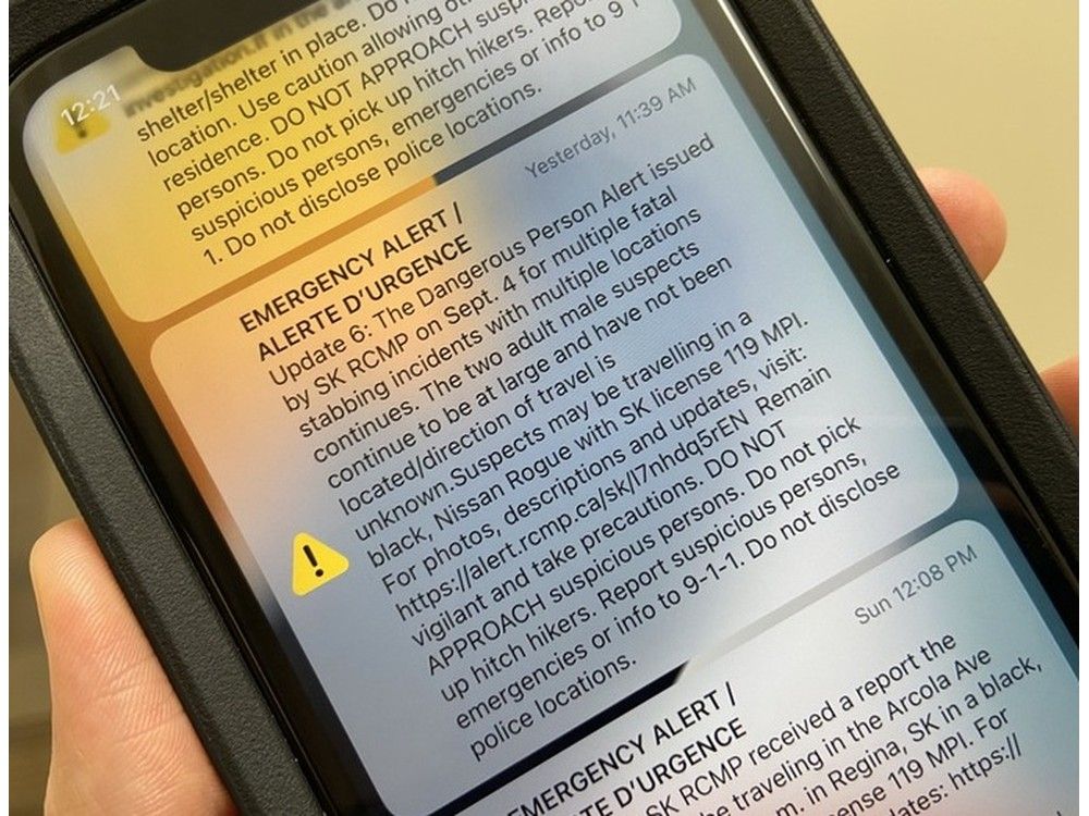 A phone screen showing multiple RCMP emergency alerts regarding the mass casualty incident on the James Smith Cree Nation.