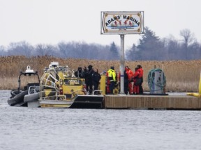Searchers dock at a marina in Akwesasne, Que. Friday, March 31, 2023.