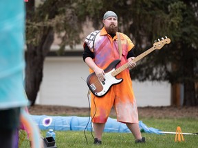 One of his many roles in Zero Gravity, Donovan Sheirer plays guitar in his final Theatre in the Park production.