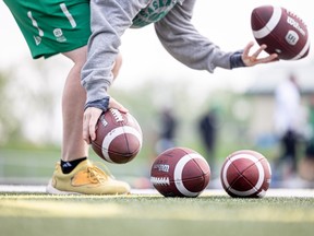 Juggling footballs at Rider camp