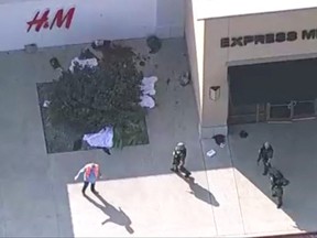 Police respond to a shooting in the Dallas area's Allen Premium Outlets, which authorities said has left multiple people injured in Allen, Texas, May 6, 2023 in a still image from video.