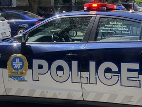 Montreal police are investigating a second homicide in less than 12 hours after a man was found shot dead in a parking lot in a northern borough. A police cruiser is shown at an apartment building in Montreal, Sunday, Aug. 7, 2022.