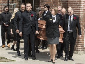 Family members carry the casket of singer-songwriter Gordon Lightfoot after a funeral service at St. Paul's United Church, in his hometown of Orillia, Ont., Monday, May 8, 2023. The legendary Canadian artist died May 1, at the age of 84 from natural causes.