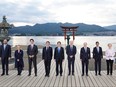 G7 leaders (left to right) European Council President Charles Michel, Italian Premier Giorgia Meloni, Canada's Prime Minister Justin Trudeau, French President Emmanuel Macron, Japanese Prime Minister Fumio Kishida, U.S. President Joe Biden, German Chancellor Olaf Scholz, U.K. Prime Minister Rishi Sunak and European Commission President Ursula von der Leyen pose for the family photo at the Itsukushima Shrine during the G7 Summit on May 19, 2023 in Hiroshima, Japan.