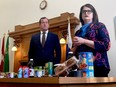 Opposition finance critic Trent Wotherspoon and party leader Carla Beck, right, stand in front of a table of groceries at a press conference on May 8, 2023 in Regina, Sask. (REGINA LEADER-POST)