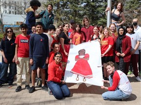 A group of students from Aden Bowman Collegiate's Collective Voice program gathered outside Saskatoon City Hall to spread awareness of Red Dress Day. Photo taken May 5, 2023 in Saskatoon.