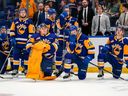 Saskatoon Blades' players spend their final few minutes on the ice after they were eliminated on Wednesday.