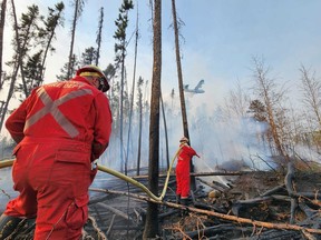 Firefighters from the La Ronge Regional Fire Department battle blazes in northern Saskatchewan in May 2023. (image courtesy La Ronge Regional Fire Department)