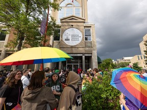 round 100 people rallied against bigotry outside of the GCSS board building downtown Saskatoon.