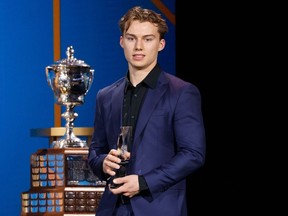 Connor Bedard holds the E. J. McGuire Award of Excellence during the 2023 NHL Awards at Bridgestone Arena on June 26, 2023 in Nashville, Tennessee.