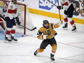 Vegas Golden Knights right wing Mark Stone, center, celebrates after scoring as Florida Panthers goaltender Sergei Bobrovsky, left, sits in goal during the first period in Game 5 of the NHL hockey Stanley Cup Finals Tuesday, June 13, 2023, in Las Vegas.