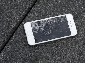 An Apple iPhone with a cracked screen is seen after a drop test from the DropBot, a robot used to measure the sustainability of a phone to dropping, at the offices of SquareTrade in San Francisco,&ampnbsp;Aug. 26, 2015.&ampnbsp;Those in favour of creating a federal right to repair law say the government should avoid shaping such legislation according to the wishes of special interest lobbyists as Ottawa gets set to launch consultations on the issue.