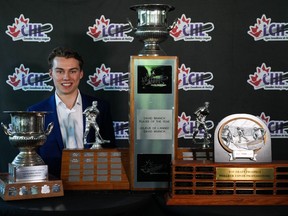 Regina Pats centre Connor Bedard poses for photographs with the trophies he received at the Canadian Hockey League awards ceremony, in Kamloops, B.C., on Saturday, June 3, 2023. Bedard, the presumed No. 1 pick of this year's NHL draft won the CHL Top Prospect, Top Scorer, and David Branch Player of the Year awards. It's the first time since the Top Scorer award was introduced in 1994 that a player has won all three in a single season.