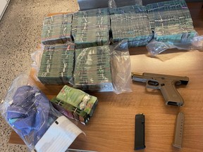 A large quantity of Canadian currency, a restricted firearm and ammunition.