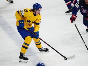 Sweden's Leo Carlsson controls the puck during the group A match between Sweden and France at the ice hockey world championship in Tampere, Finland, Saturday, May 20, 2023. With Connor Bedard all but assured of going first overall to the Chicago Blackhawks, the real action and drama at the upcoming NHL draft in Nashville starts at No. 2. An impressive array of talent at the forward position is led by No. 2 North American skater Adam Fantilli and top-ranked European counterpart Carlsson, who both would be in the conversation as the top pick almost any other year.THE CANADIAN PRESS/AP/Pavel Golovkin