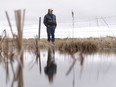 Lane Mountney poses for a photo near the creek that runs by his grain farm southwest of Moosomin on Friday April 14, 2023. Mountney is concerned the Wawken Drainage Project will affect his farm's well water and reduce the productivity and acreage of his land.