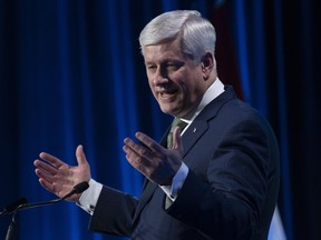Former Prime Minister Stephen Harper delivers the keynote address at a conference, Wednesday, March 22, 2023 in Ottawa.