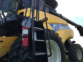 A combine with a properly-mounted fire extinguisher.