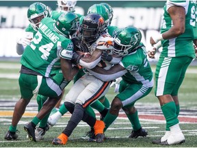 The Saskatchewan Roughriders make a tackle on BC Lions running back Taquan Mizzell (23) during the first half of pre season CFL action at Mosaic Stadium on Saturday, May 27, 2023 in Regina.