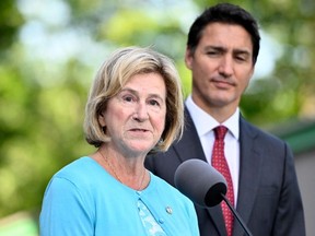 FILE: Minister of Public Services and Procurement Helena Jaczek speaks to reporters as Prime Minister Justin Trudeau looks on, at Rideau Hall in Ottawa, on Wednesday, Aug. 31, 2022.