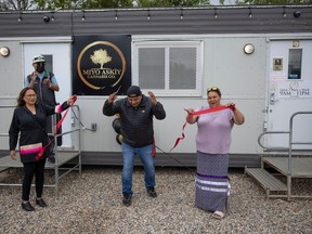 (L to R) Chief Mark Fox, Councillor Marilyn Kaiswatum, Councillor Everet Sayer and Councillor Crystal Crowe help cut a ribbon during the Piapot First Nations grand opening of their Cannabis store on Angus street on Wednesday, July 19, 2023 in Regina. KAYLE NEIS / Regina Leader-Post