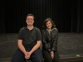 Graeme Hopkins and Soni Clark, co-directors of Bugs in Amber, sit on the stage at the Broadway Theatre in Saskatoon after the opening night of their production at the Saskatoon Fringe Festival.