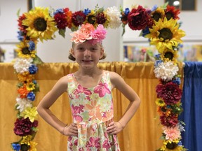 Charlotte Kostyk strikes her best, bravest 'Ukrainian pose' during the Saskatoon Folkfest on August 17, 2023.